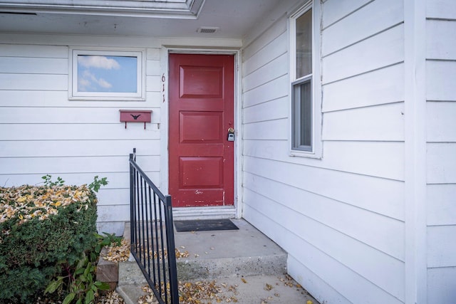 property entrance with visible vents