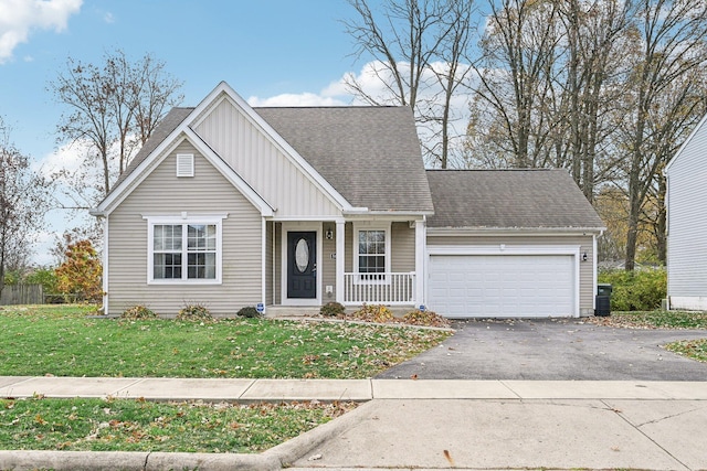 view of front of house featuring a front yard and a garage