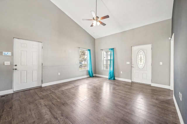 foyer with ceiling fan, dark hardwood / wood-style flooring, and high vaulted ceiling