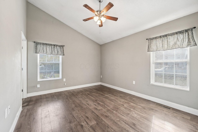 unfurnished room with dark hardwood / wood-style floors, vaulted ceiling, and ceiling fan