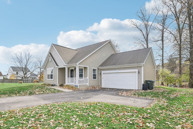 view of front of house with a porch, a garage, a front lawn, and central air condition unit