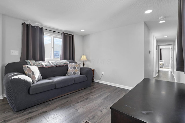 living room with dark wood-type flooring