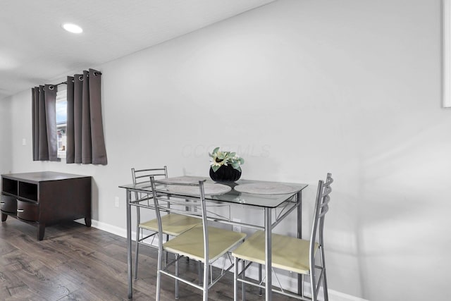 dining room featuring dark hardwood / wood-style flooring