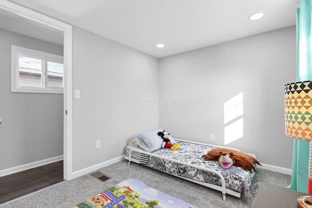 bedroom featuring hardwood / wood-style flooring