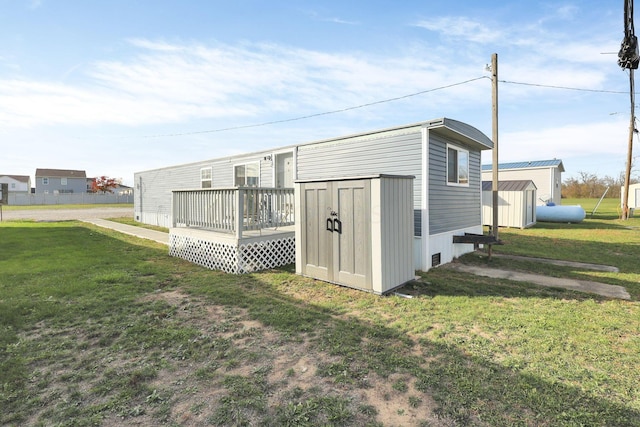 view of outbuilding featuring a lawn