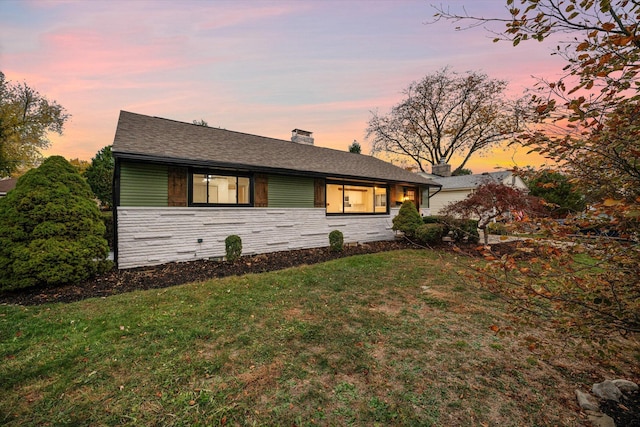 view of front of house with a yard