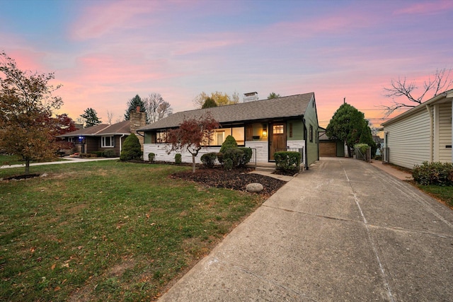 view of front of property featuring a lawn and a porch