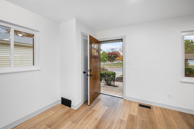 foyer entrance featuring light wood-type flooring