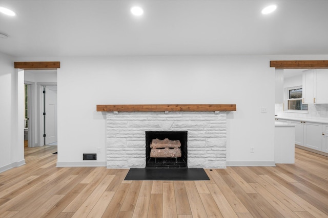 unfurnished living room with light hardwood / wood-style floors and a fireplace