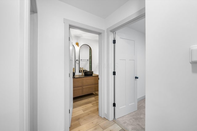 hallway with light wood-type flooring