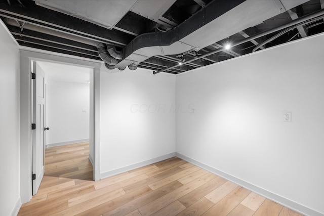 basement with wood-type flooring