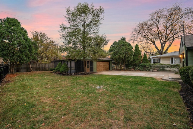 view of yard at dusk