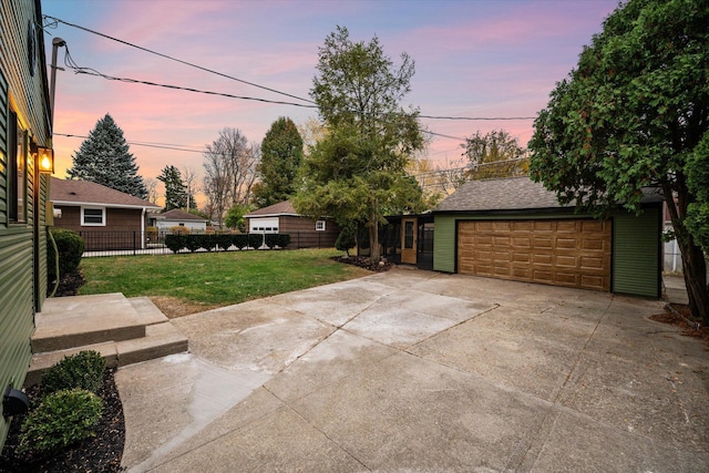 view of front of home with a lawn and a garage