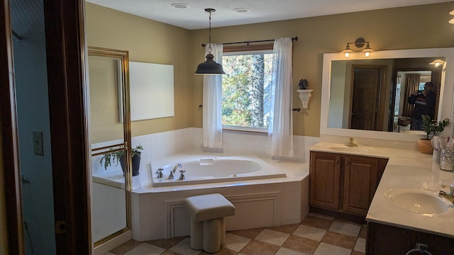 bathroom with plus walk in shower and vanity