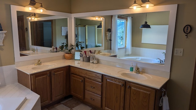 bathroom with tile patterned floors, vanity, and shower with separate bathtub