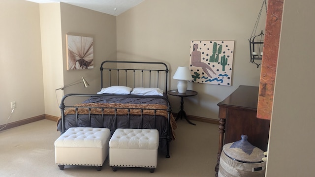 carpeted bedroom with vaulted ceiling