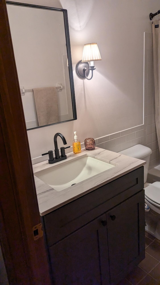 full bathroom with tile patterned flooring, vanity, toilet, and tub / shower combination