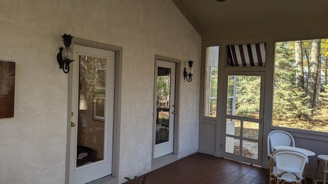 sunroom / solarium with vaulted ceiling