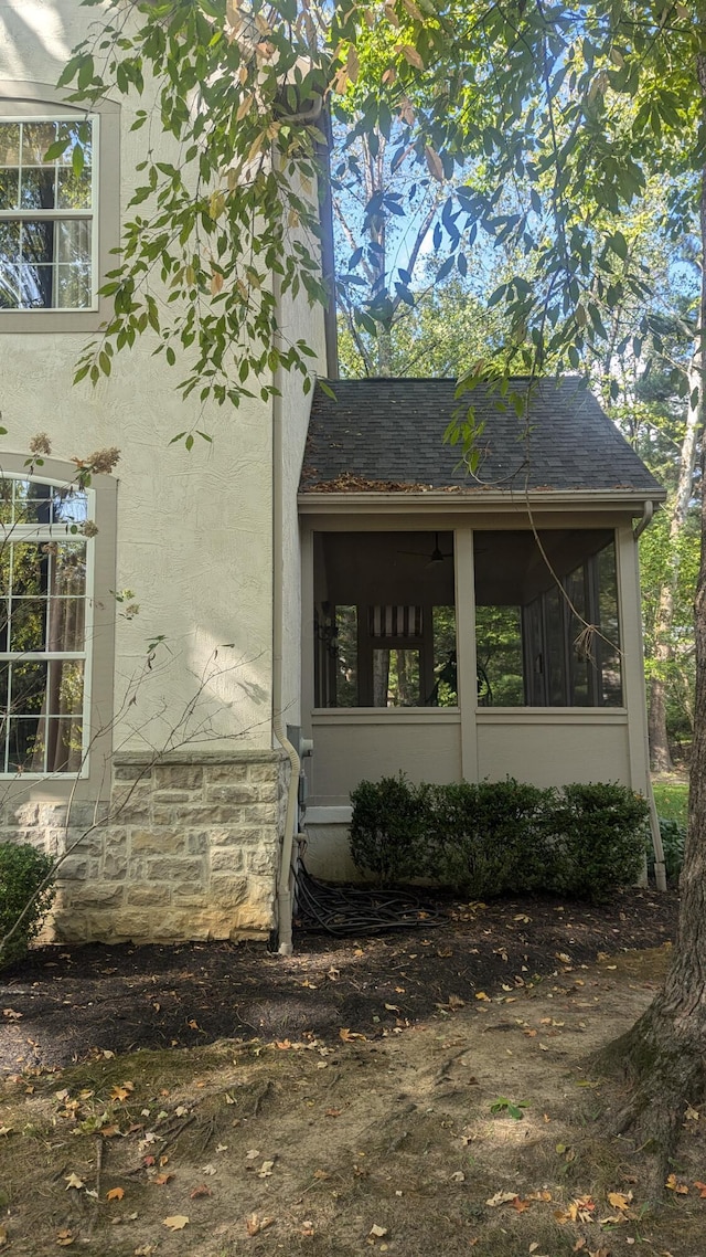 view of home's exterior featuring a sunroom