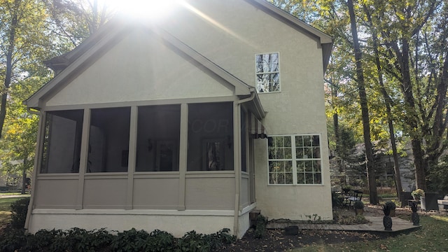 back of house with a sunroom