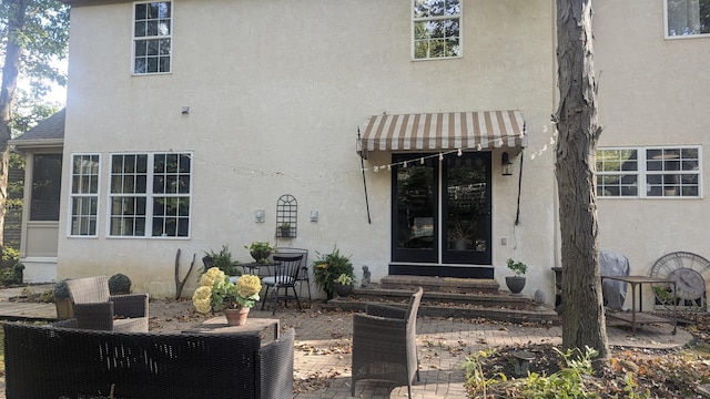 doorway to property featuring a patio area