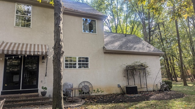 view of side of property with cooling unit