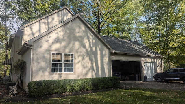 view of side of property with a garage