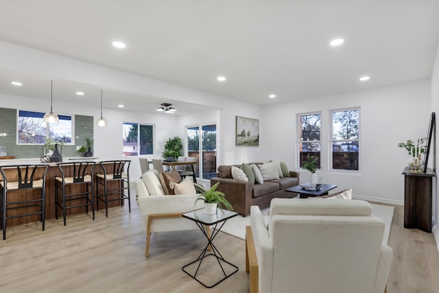 living room featuring plenty of natural light and light hardwood / wood-style floors