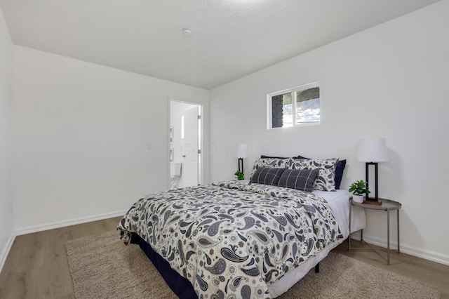 bedroom featuring hardwood / wood-style flooring