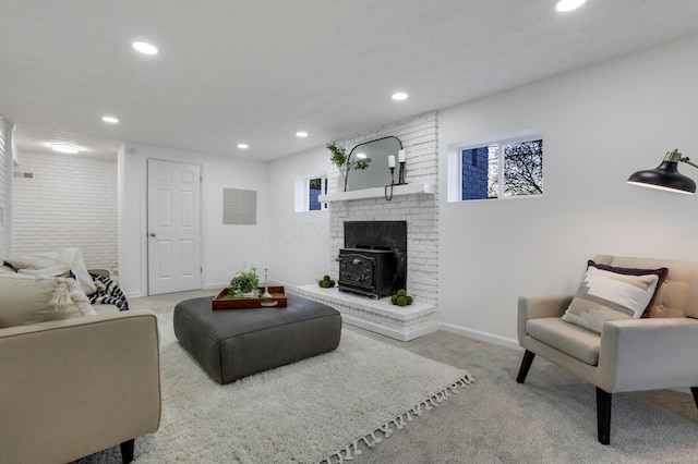 living room with light carpet and a wood stove