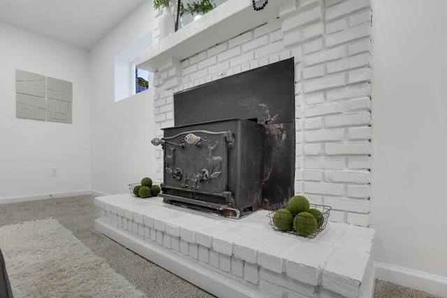 room details featuring carpet floors and a wood stove