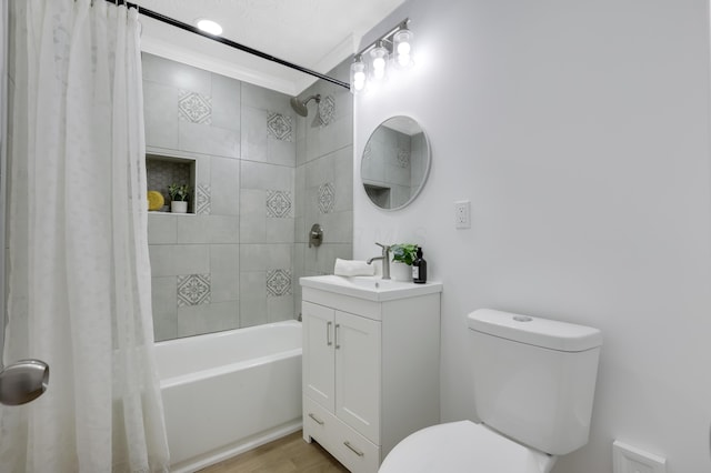 full bathroom featuring hardwood / wood-style flooring, vanity, toilet, and shower / bath combo with shower curtain