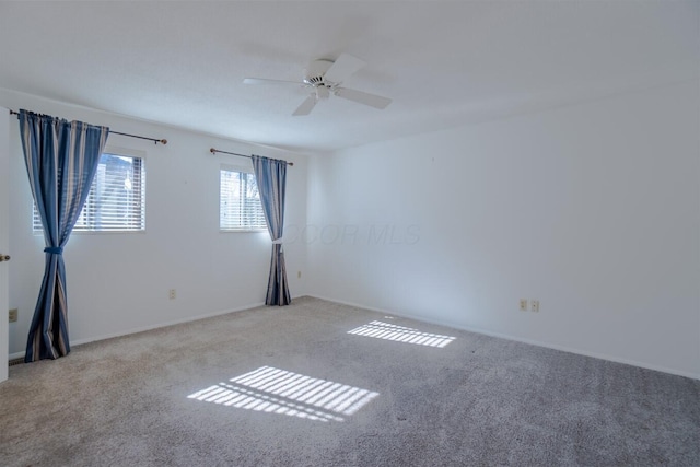 carpeted empty room with ceiling fan