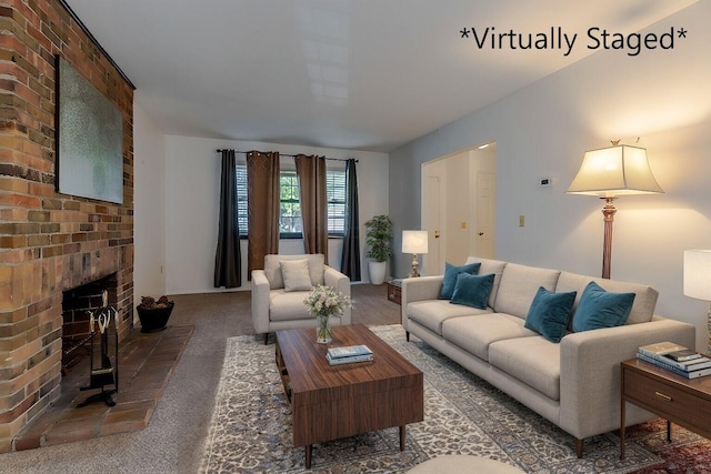 living room with dark colored carpet and a fireplace