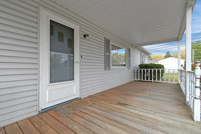 wooden terrace with a porch