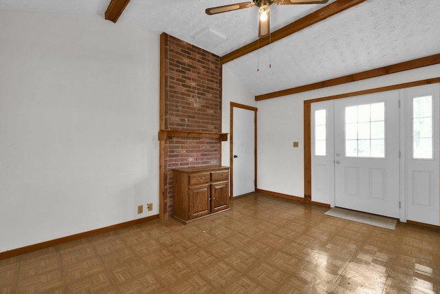 foyer entrance with a textured ceiling, vaulted ceiling with beams, ceiling fan, and light parquet flooring