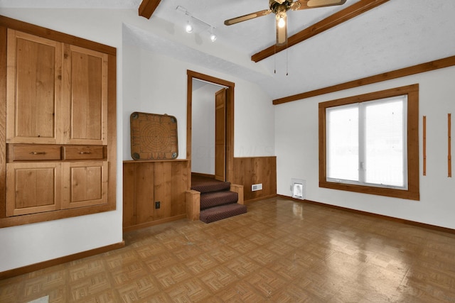 unfurnished room with vaulted ceiling with beams, ceiling fan, and light parquet floors