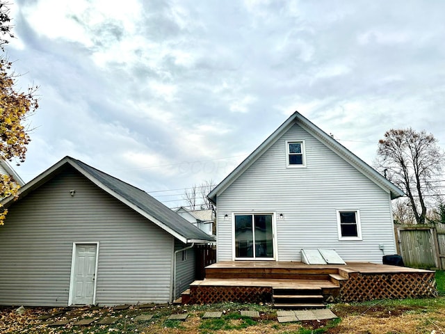 rear view of house with a wooden deck