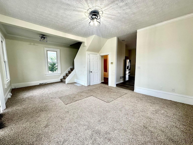 interior space with carpet flooring and a textured ceiling