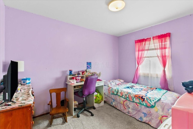 bedroom featuring light colored carpet