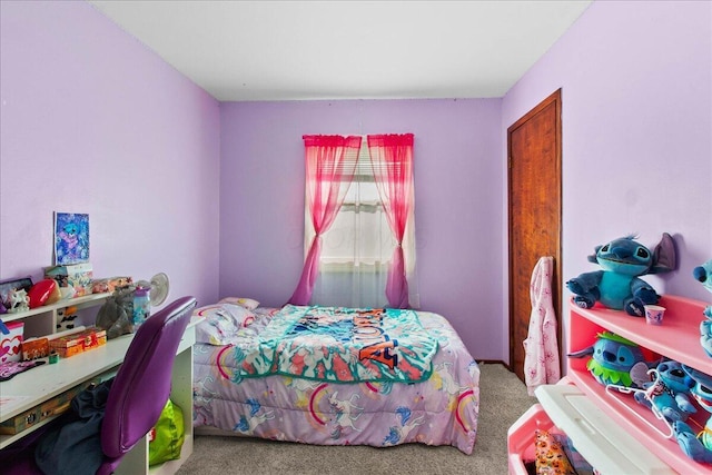 bedroom featuring carpet