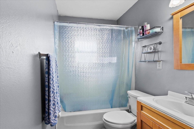 full bathroom featuring vanity, toilet, and shower / bath combo with shower curtain