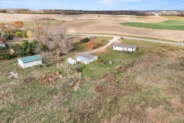 birds eye view of property featuring a rural view