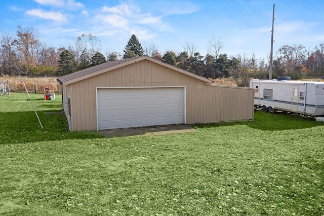 garage featuring a lawn