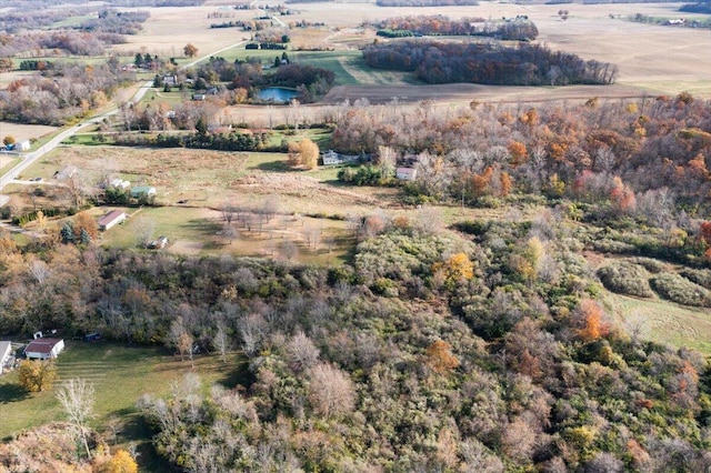 birds eye view of property featuring a rural view