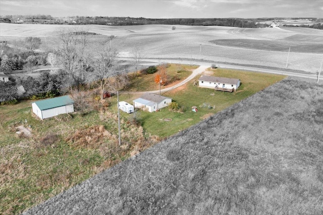 birds eye view of property with a rural view