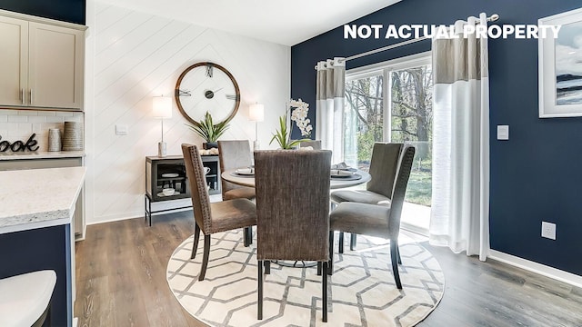 dining area with hardwood / wood-style floors