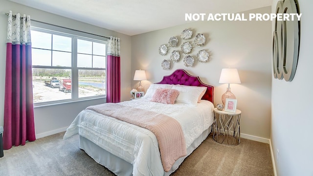 carpeted bedroom featuring multiple windows