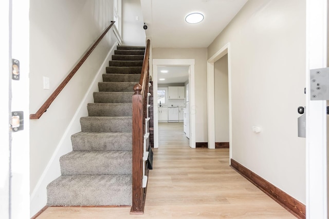 staircase with wood-type flooring