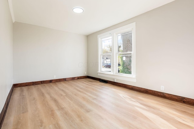 unfurnished room featuring light hardwood / wood-style flooring